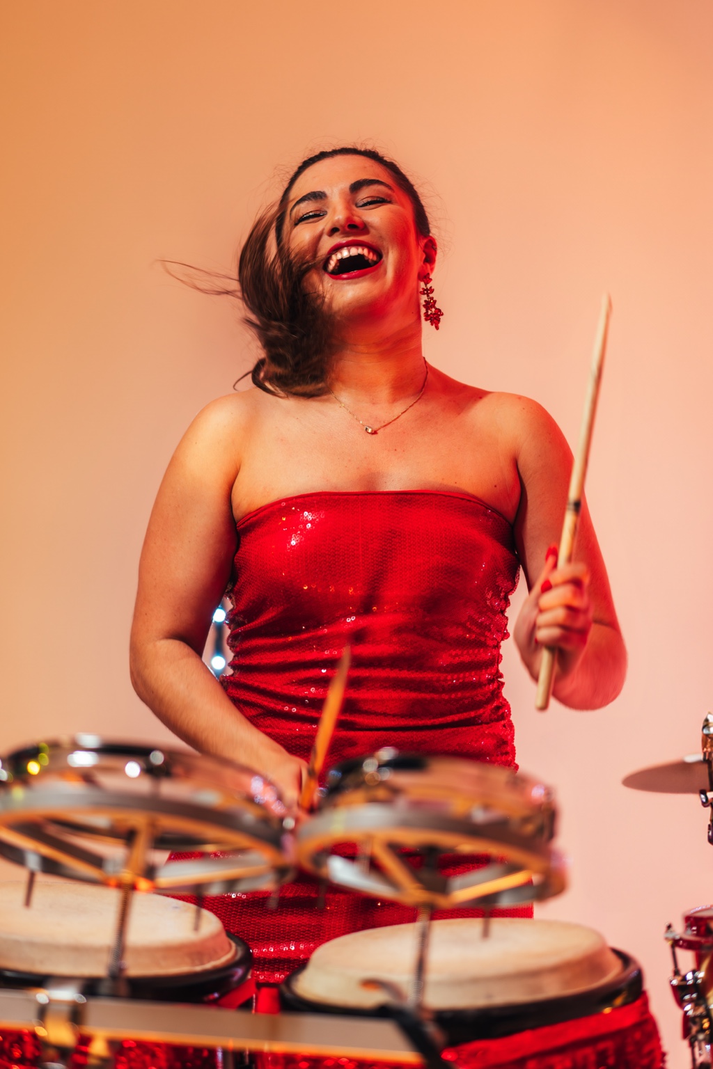 Bongo player performing alongside DJ entertainment